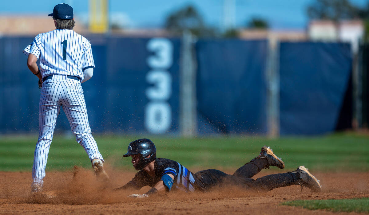 Basic runner Lyndon Lee slides safely into second base below Spring Valley infielder Logan Rose ...