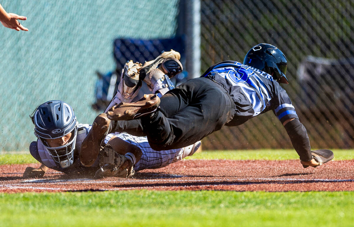 Spring Valley catcher Cameron Pienta looks to Basic runner Ty Southisene who safely touches hom ...