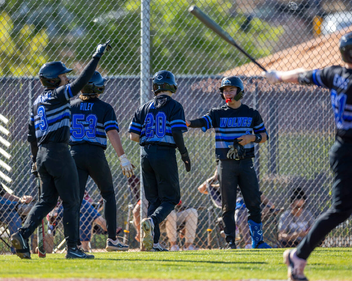 Basic players celebrate more runs against Spring Valley during the fourth inning of their NIAA ...