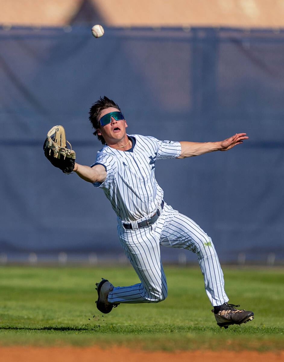 Spring Valley outfielder Matthew Rogers dives in an attempt at a fly ball against Basic during ...