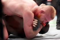 Bo Nickal, top, submits Jamie Pickett submits in a lightweight bout during UFC 285 at T-Mobile ...