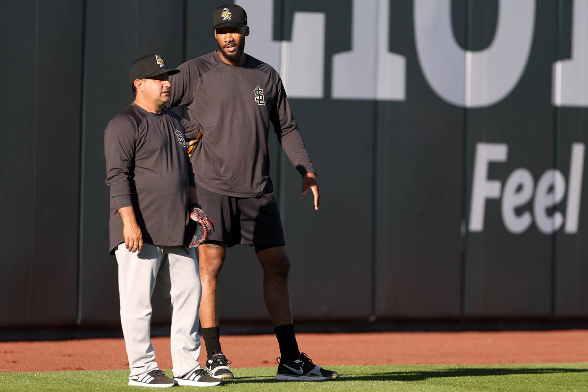 Salt Lake City Bees relief pitcher Amir Garrett, right, shags in the outfield during batting pr ...