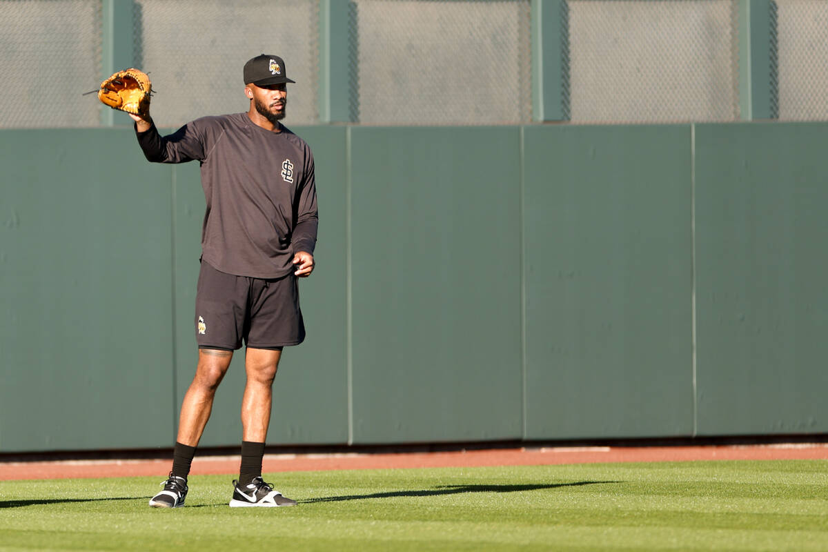 Salt Lake City Bees relief pitcher Amir Garrett, right, shags in the outfield during batting pr ...