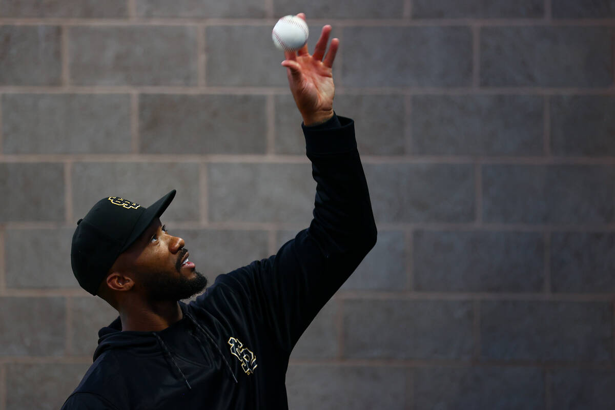 Salt Lake City Bees relief pitcher Amir Garrett tosses a ball to fans during a Minor League Bas ...