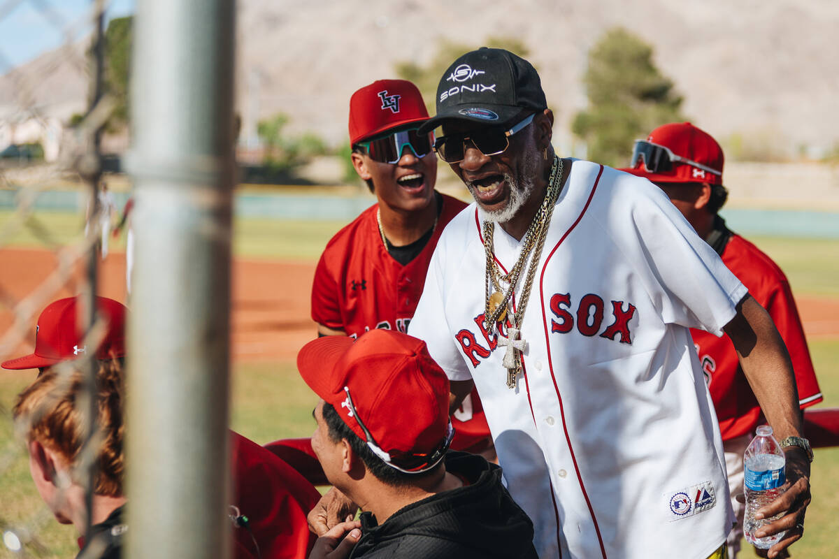 Las Vegas players get pumped up by a mentor during a baseball game between Faith Lutheran and L ...