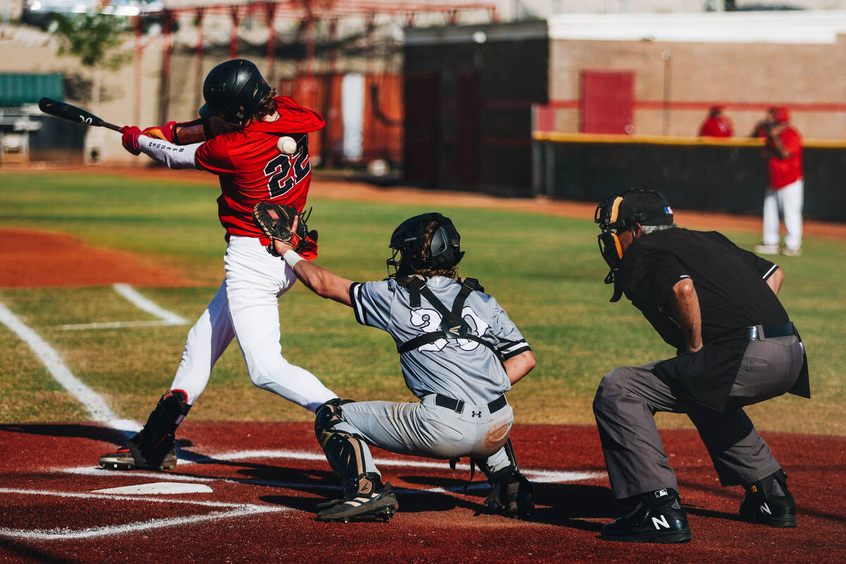 The ball flies by Las Vegas’ Bryan Bull (22) and Faith Lutheran catcher Corbin Sterner ( ...