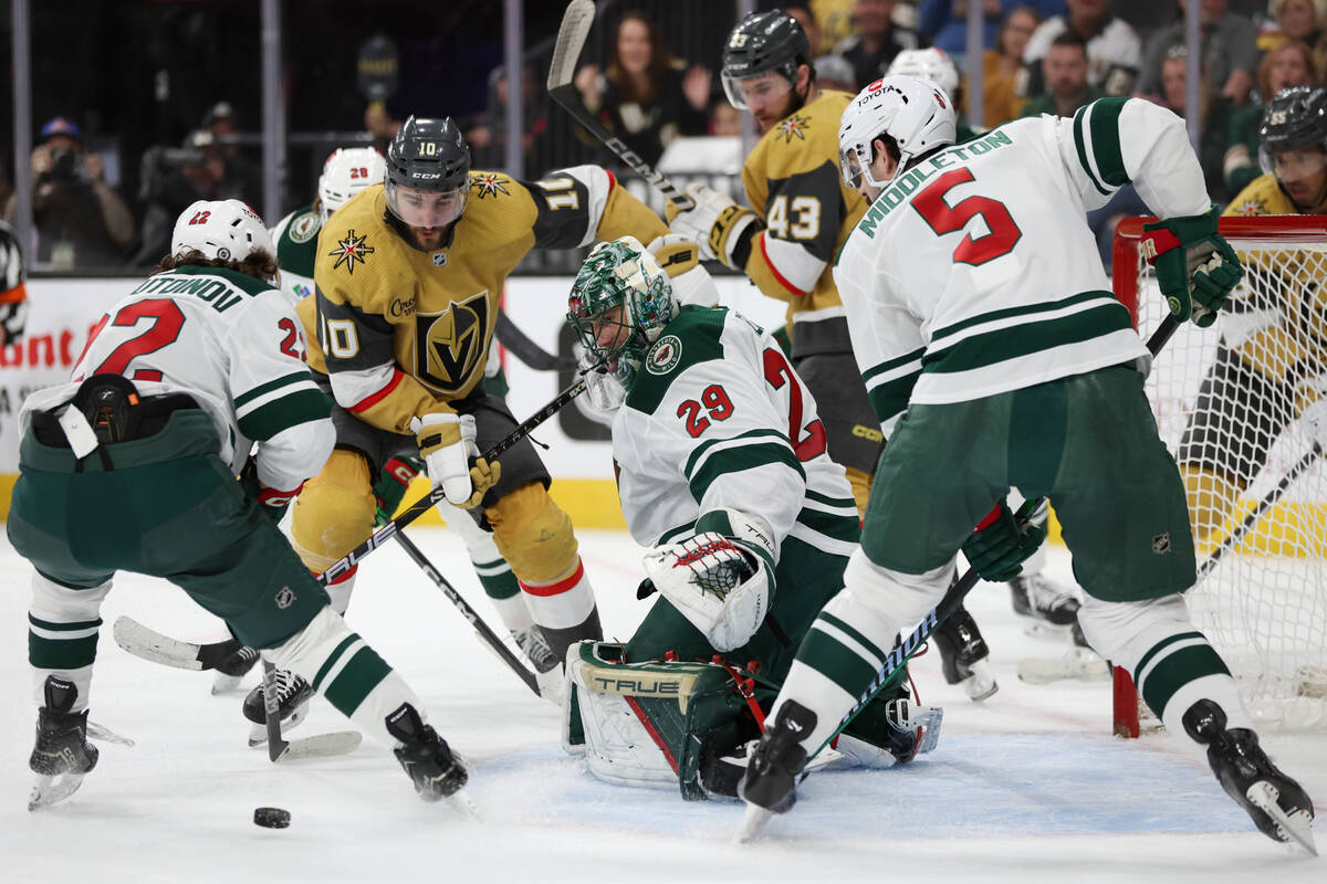 Wild goaltender Marc-Andre Fleury (29) eyes the puck after making a save against Golden Knights ...