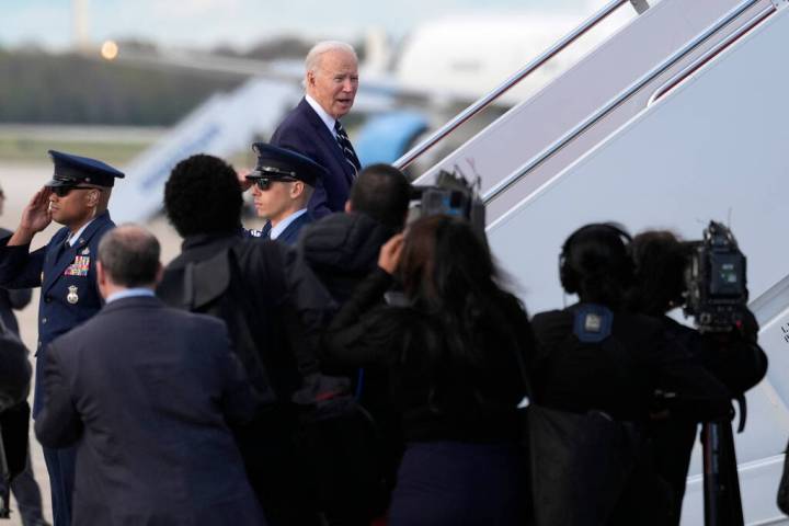 President Joe Biden speaks to reporters as he boards Air Force One, Friday, April 12, 2024, at ...