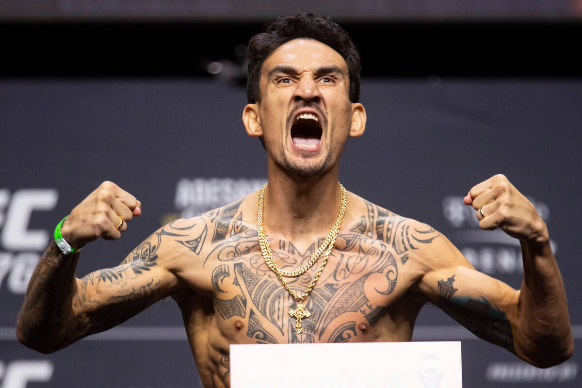 Max Holloway poses during an UFC 276 weigh-in event at T-Mobile Arena in Las Vegas, Friday, Jul ...