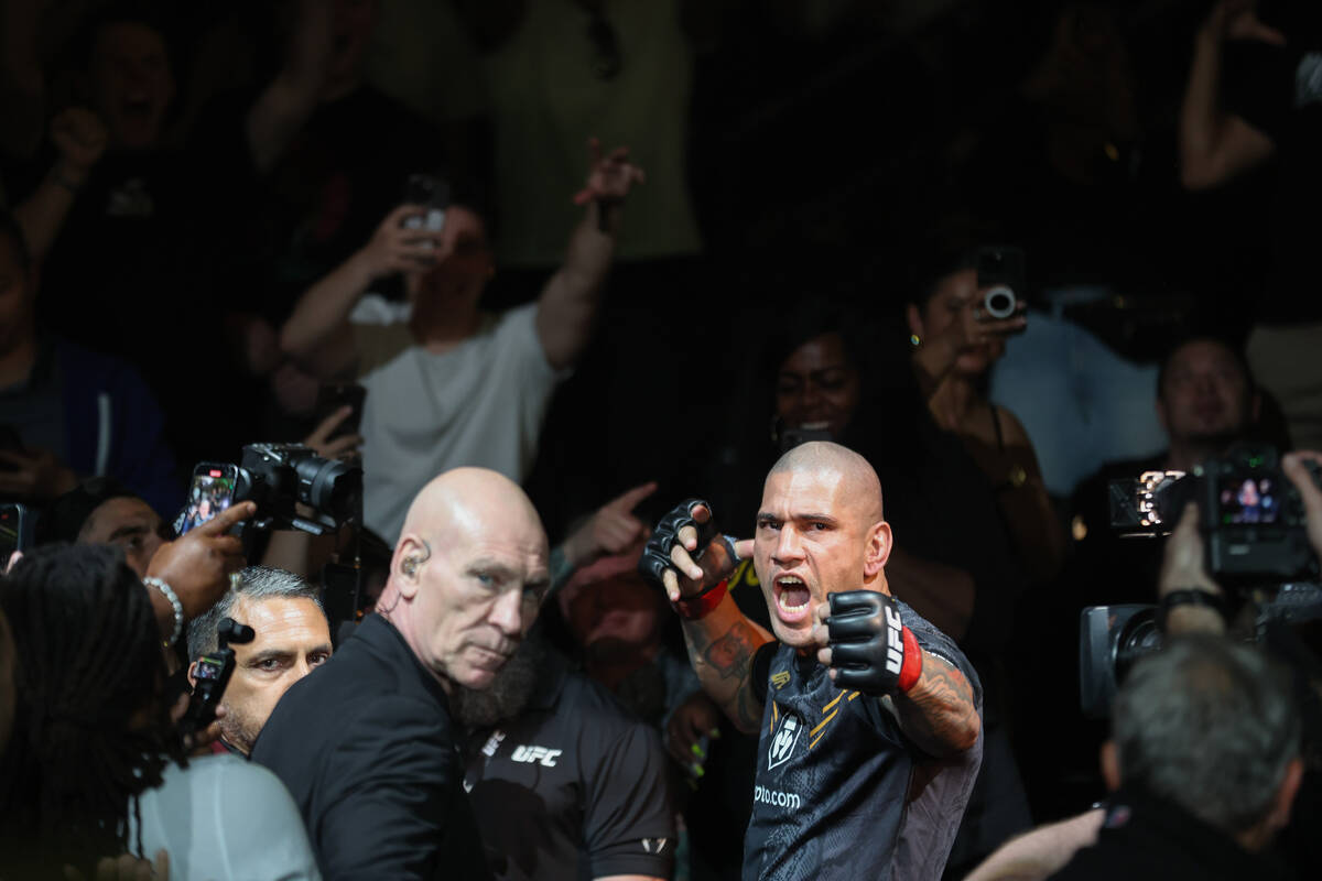 Alex Pereira mimes shooting an arrow before fighting Jamahal Hill during a UFC 300 mixed martia ...