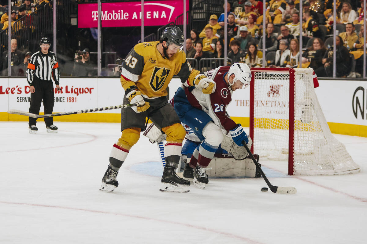 Golden Knights center Paul Cotter (43) closes in on the puck as Colorado Avalanche defenseman S ...