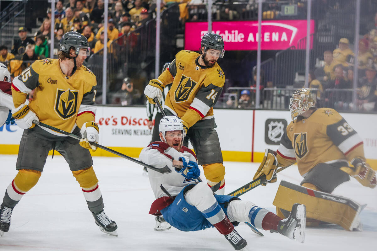 Colorado Avalanche right wing Valeri Nichushkin (13) falls onto the ice during an NHL hockey ga ...