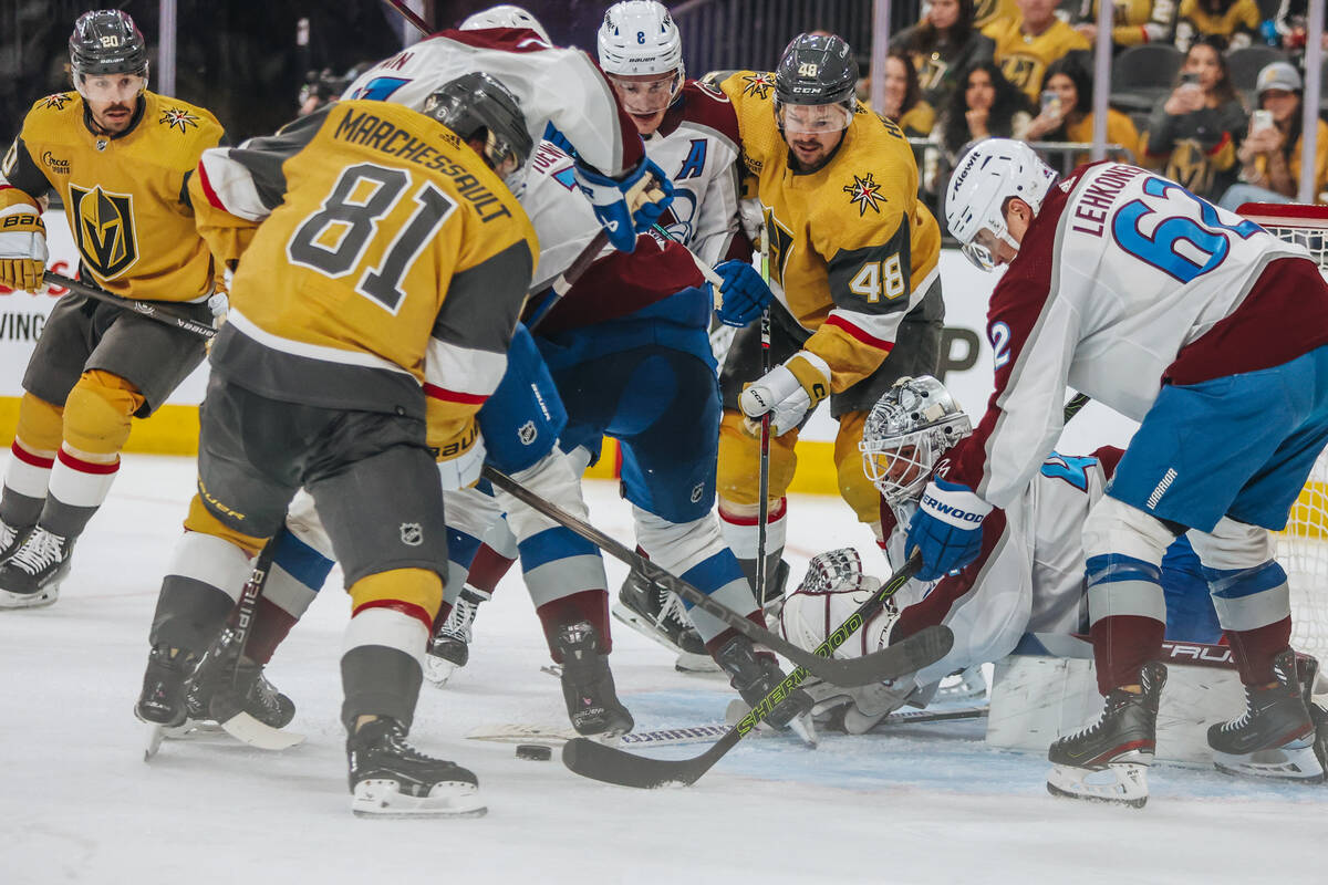 Golden Knights center Tomas Hertl (48) gets into a battle for the puck along with Golden Knight ...