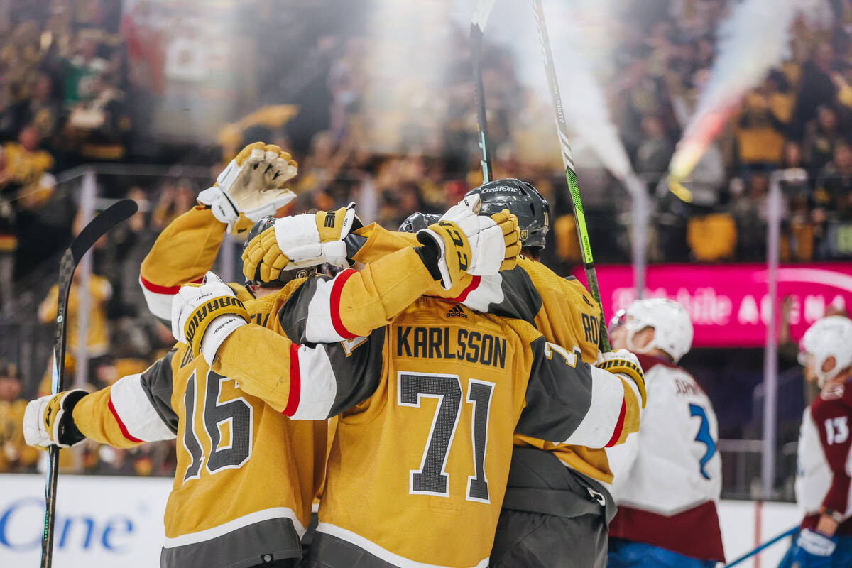 Golden Knights players celebrate a goal during an NHL hockey game between the Golden Knights an ...