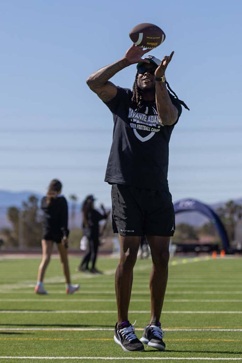 Raiders wide receiver Davante Adams makes a catch at his youth camp on Sunday, April 14, 2024, ...