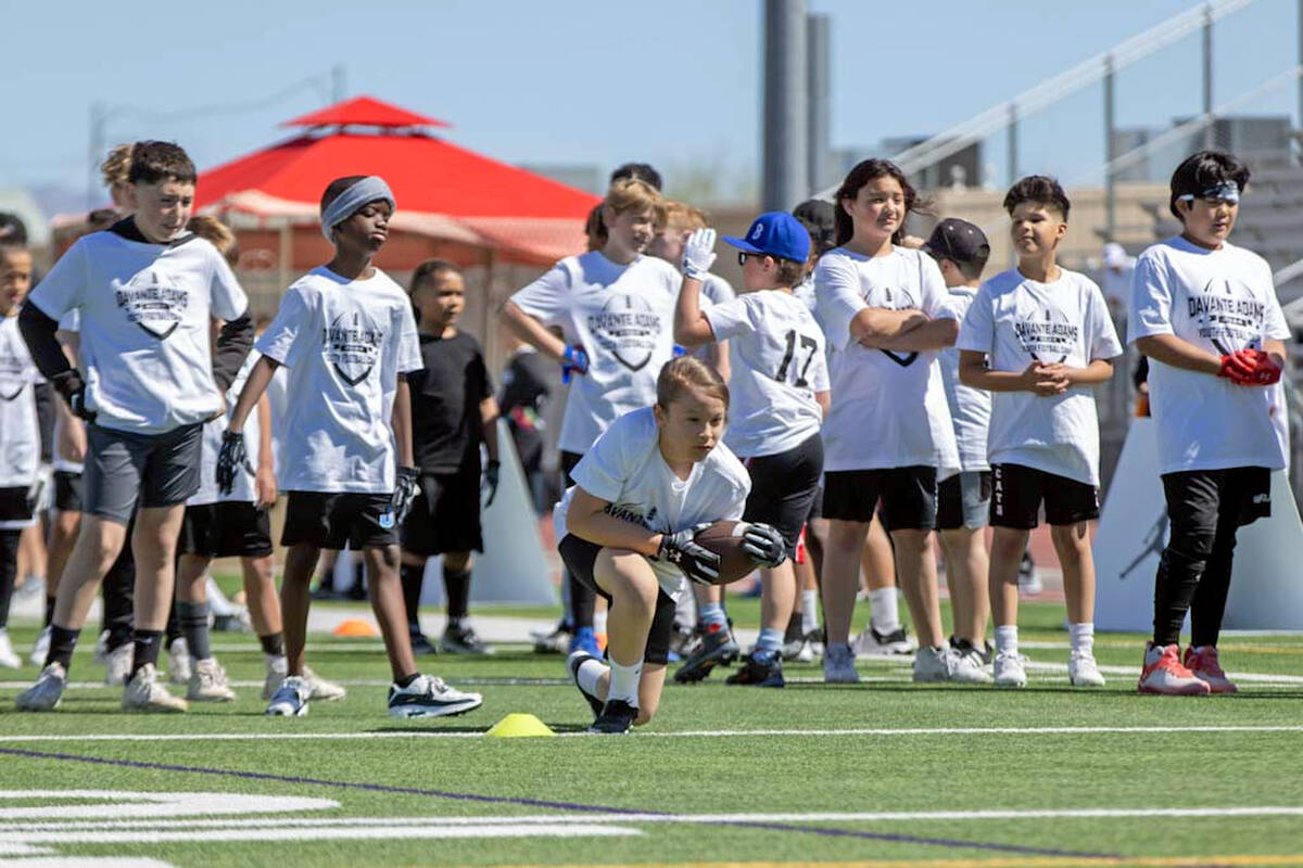 Participants of Raiders wide receiver Davante Adams’ youth camp run drills on Sunday, Ap ...