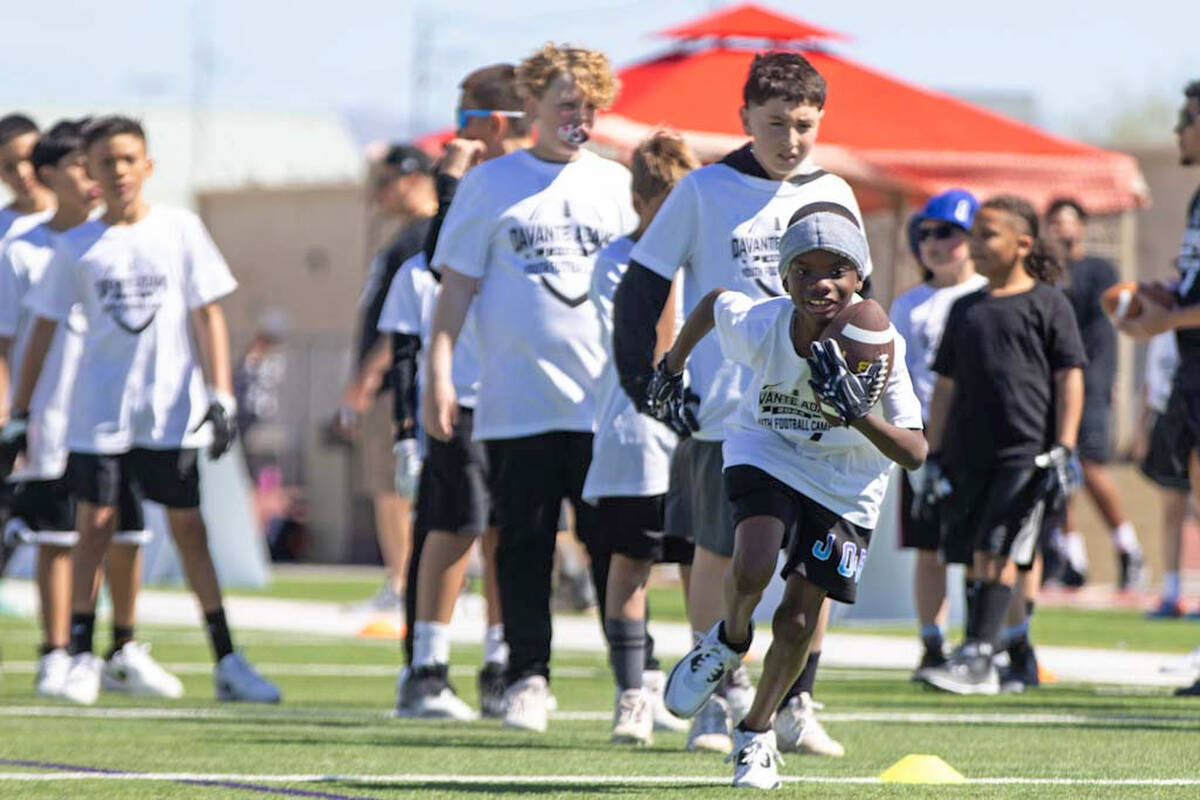 A participant of Raiders wide receiver Davante Adams’ youth camp runs a drill on Sunday, ...