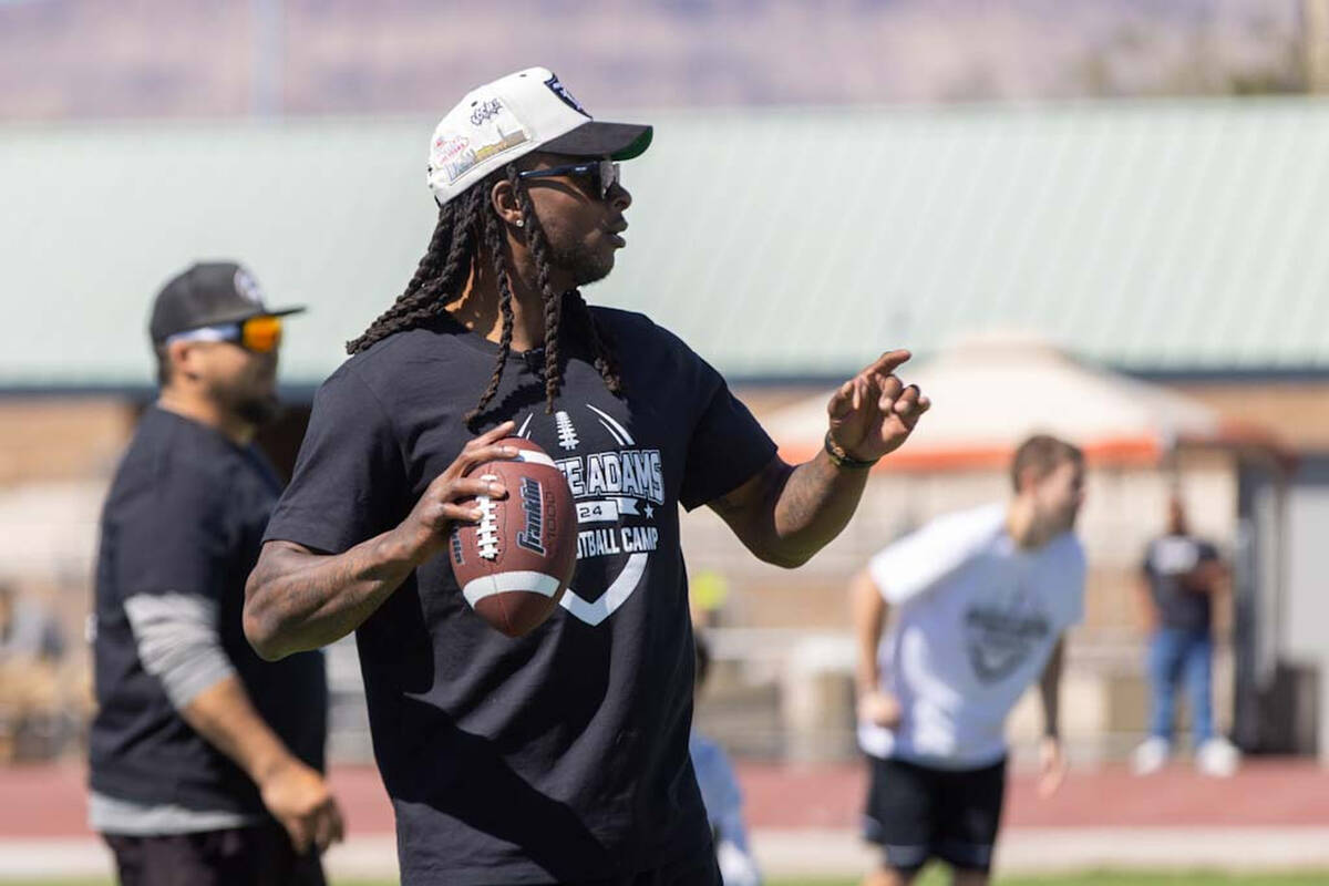Raiders wide receiver Davante Adams runs drills with participants of his youth camp on Sunday, ...
