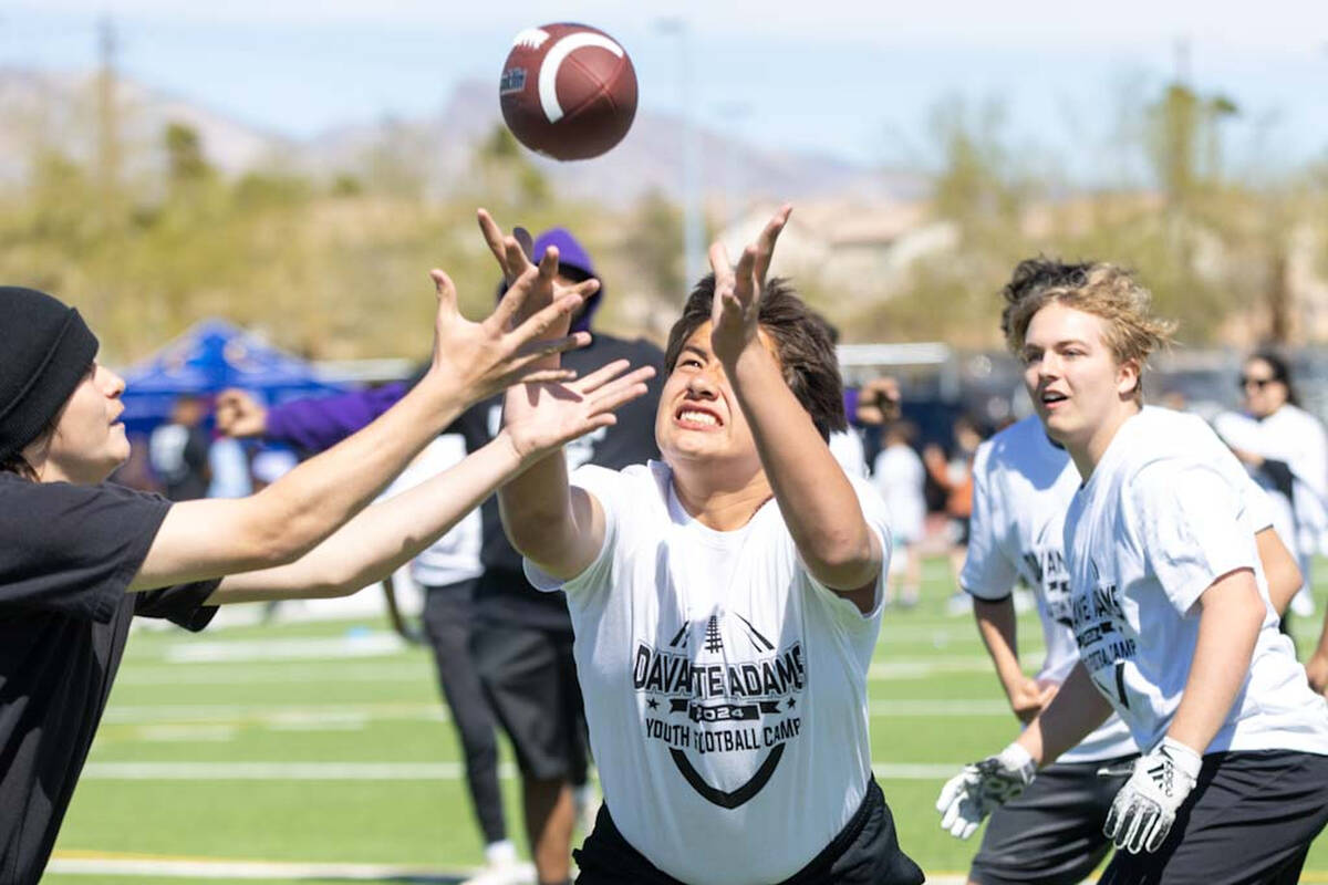 A participant of Raiders’ wide receiver Davante Adams’ youth camp prepares to mak ...