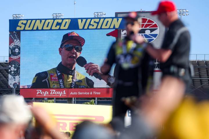 Funny car driver Bob Tasca addresses the audience after winning the NHRA 4-Wide Nationals at th ...