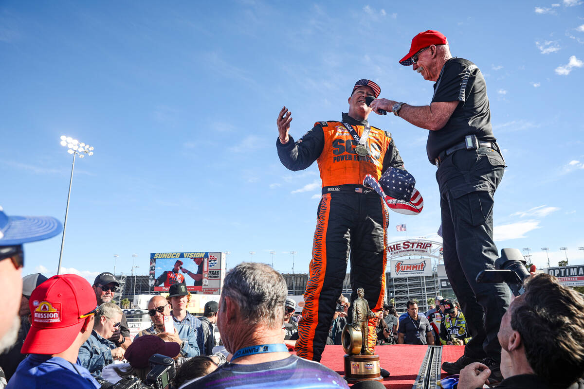 Pro stock driver Jeg Coughlin Jr. is interviewed by Alan Reinhart after winning the NHRA 4-Wide ...