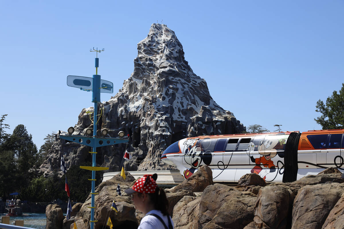 Visitors ride the Disneyland Monorail past the Matterhorn Bobsleds at Disneyland in Anaheim, Ca ...