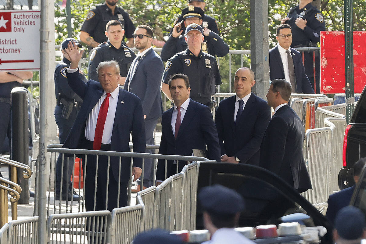 Former President Donald Trump arrives at Manhattan criminal court with his legal team, Monday, ...