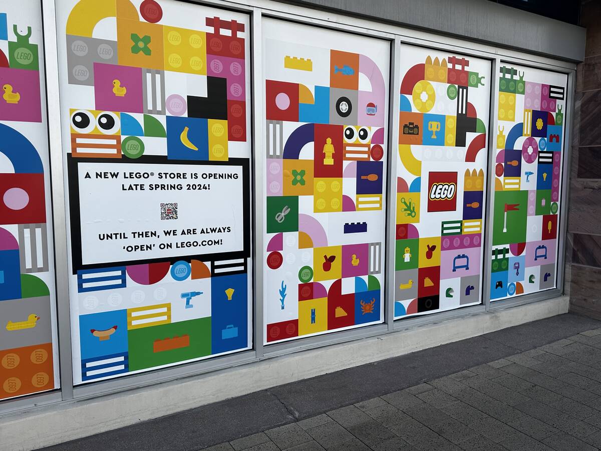A sign shown Friday, April 12, 2024, indicates that a new Lego store is set to come to Downtown ...