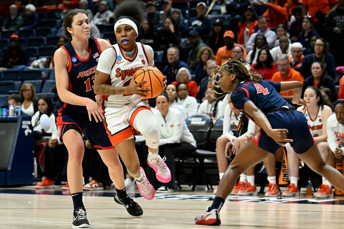 Syracuse guard Dyaisha Fair cuts between Arizona guard Helena Pueyo, left, and Arizona guard Sk ...