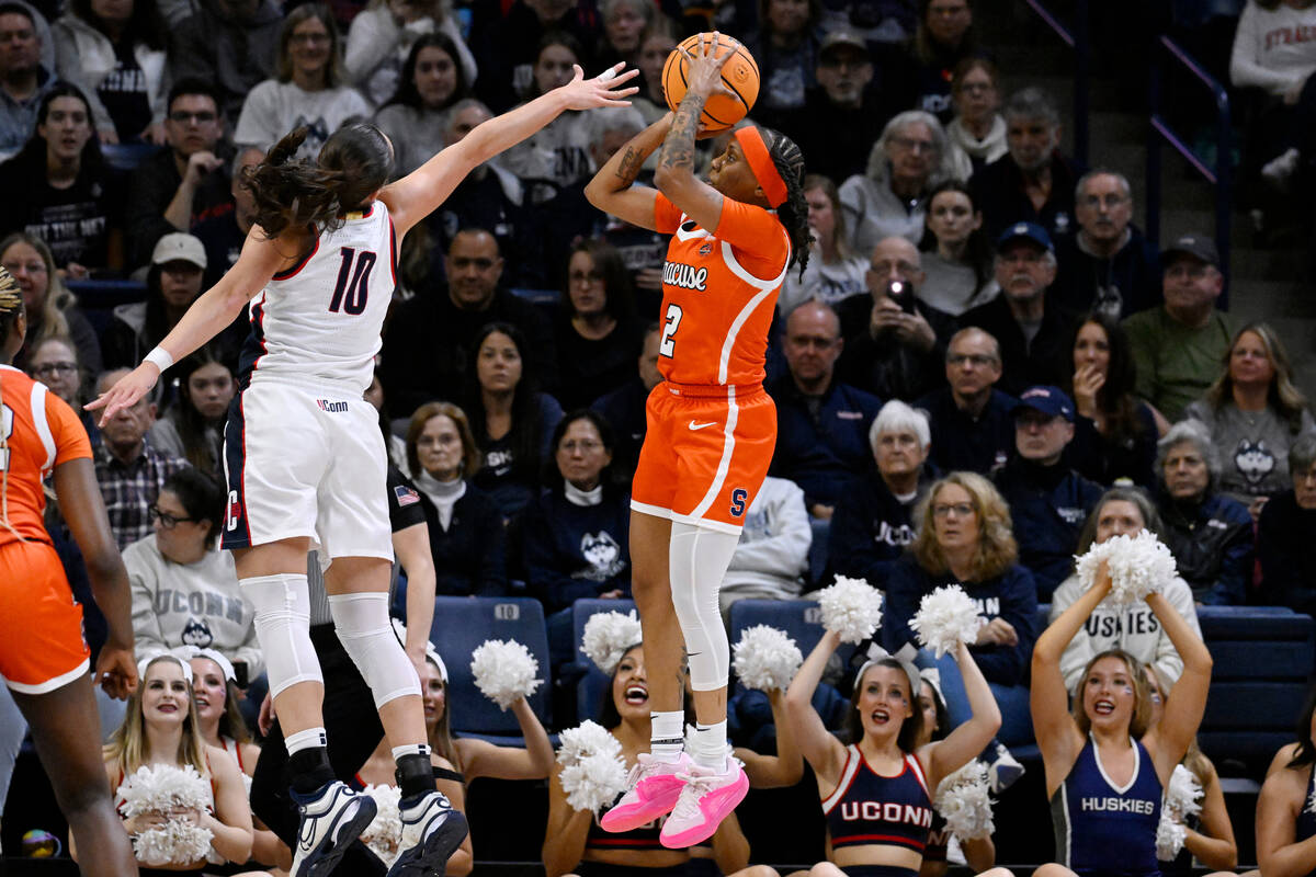 Syracuse guard Dyaisha Fair (2) shoots over UConn guard Nika Muhl (10) in the first half of a s ...