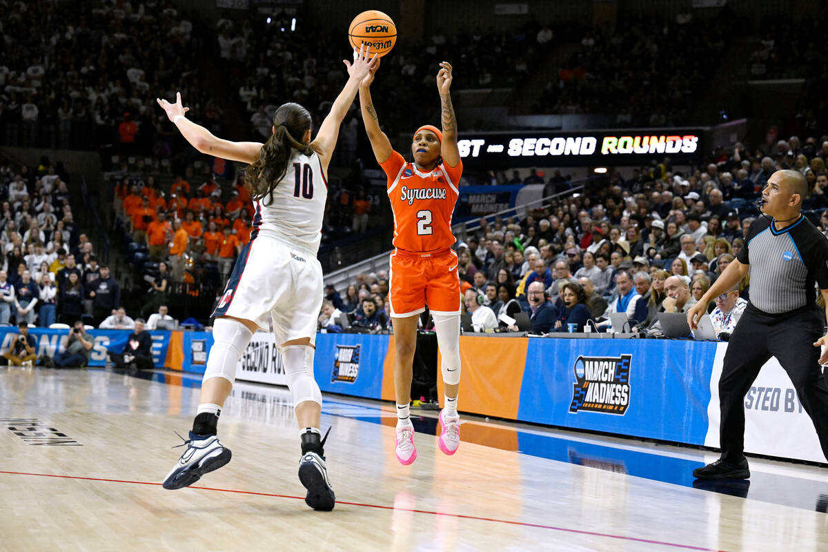 Syracuse guard Dyaisha Fair (2) shoots over UConn guard Nika Muhl (10) in the first half of a s ...