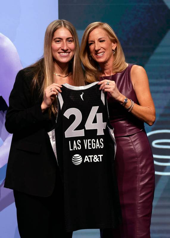 Iowa's Kate Martin, left, poses for a photo with WNBA commissioner Cathy Engelbert, right, afte ...