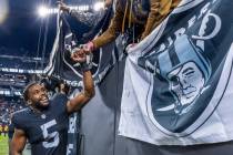 Raiders linebacker Divine Deablo (5) greets fans after defeating the Denver Broncos 27-14 follo ...