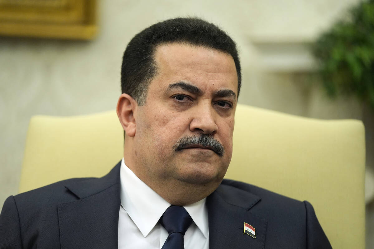 Iraq's Prime Minister Shia al-Sudani listens during a meeting with President Joe Biden in the O ...
