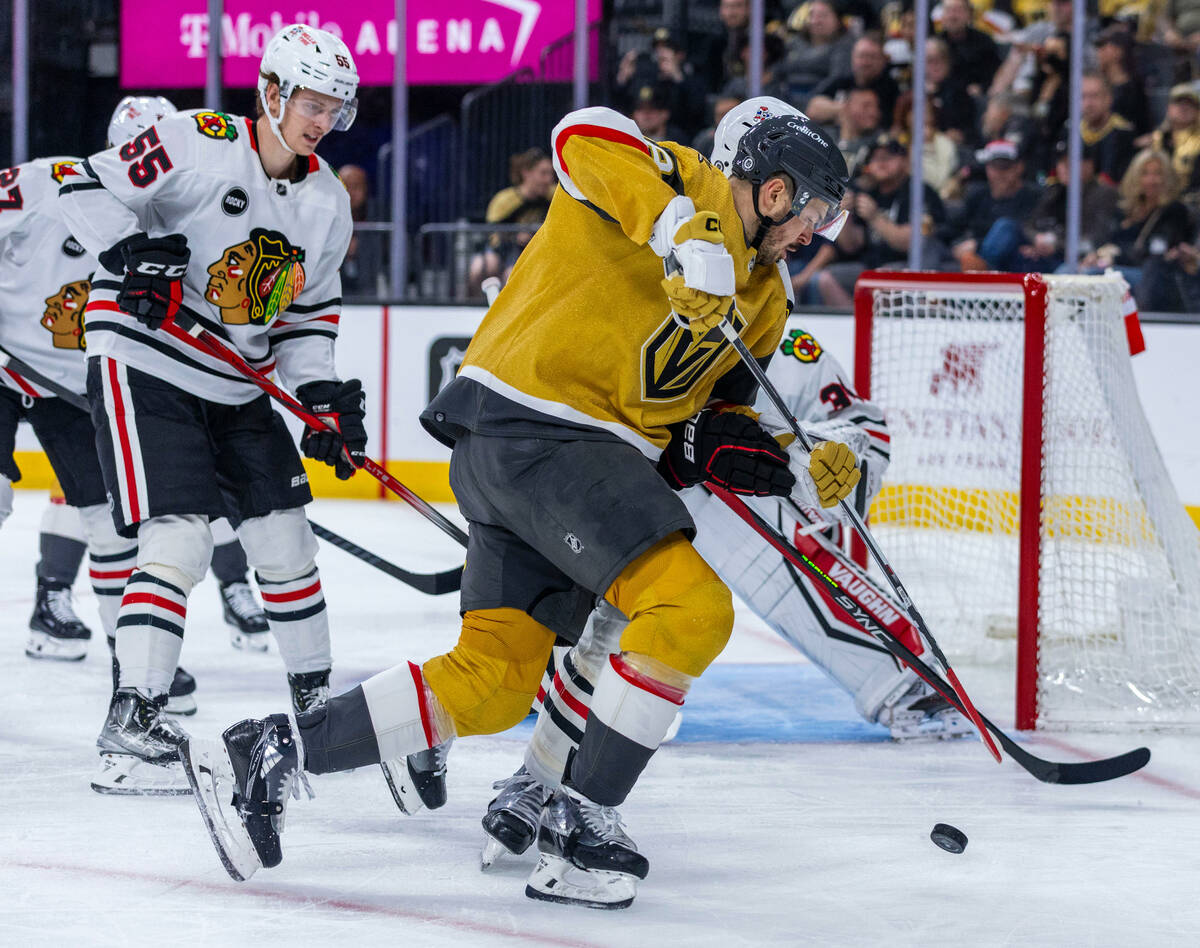 Golden Knights center Tomas Hertl (48) looks to shoot a puck past Chicago Blackhawks goaltender ...