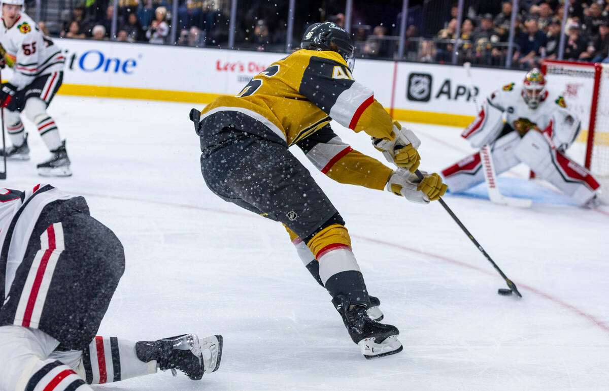 Golden Knights right wing Jonas Rondbjerg (46) breaks free for a shot attempt against Chicago B ...