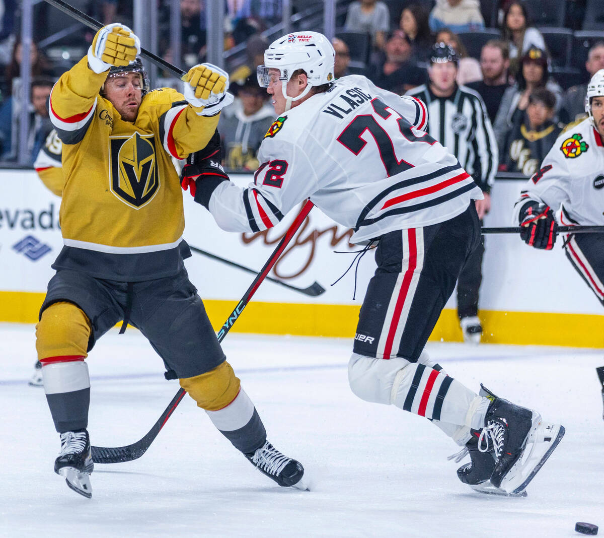 Golden Knights right wing Jonathan Marchessault (81) fights to get around Chicago Blackhawks de ...