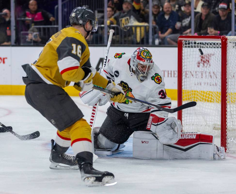 Golden Knights left wing Pavel Dorofeyev (16) sends a puck past Chicago Blackhawks goaltender P ...