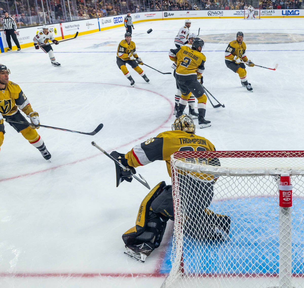 Golden Knights goaltender Logan Thompson (36) deflects a shot away from the net by the Chicago ...