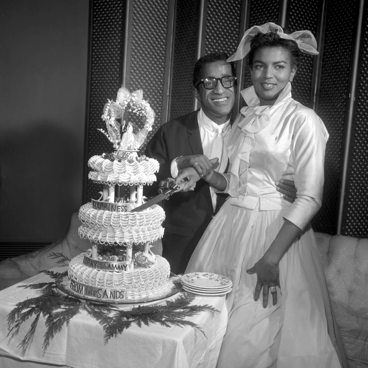 Sammy Davis Jr and Loray White cut the cake after their wedding at the Sands in Las Vegas Janua ...