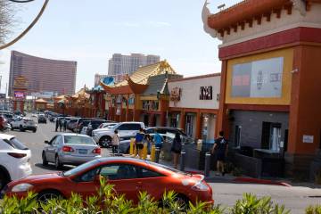 Visitors walk in Chinatown on Spring Mountain Road, on Friday, April 12, 2024, in Las Vegas. Cl ...