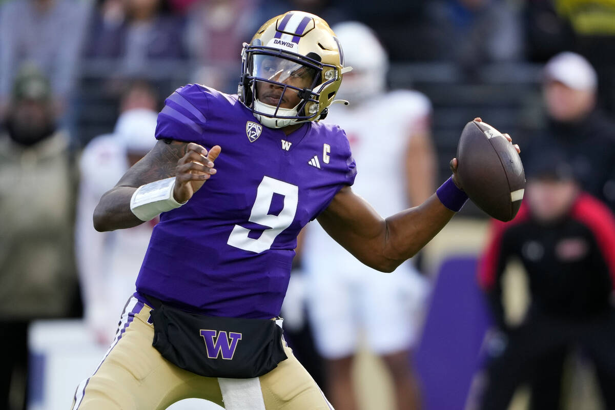 FILE - Washington quarterback Michael Penix Jr. looks to throw against Utah during the first h ...