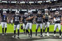 Raiders cornerback Amik Robertson (21) celebrates his interception with teammates against the N ...