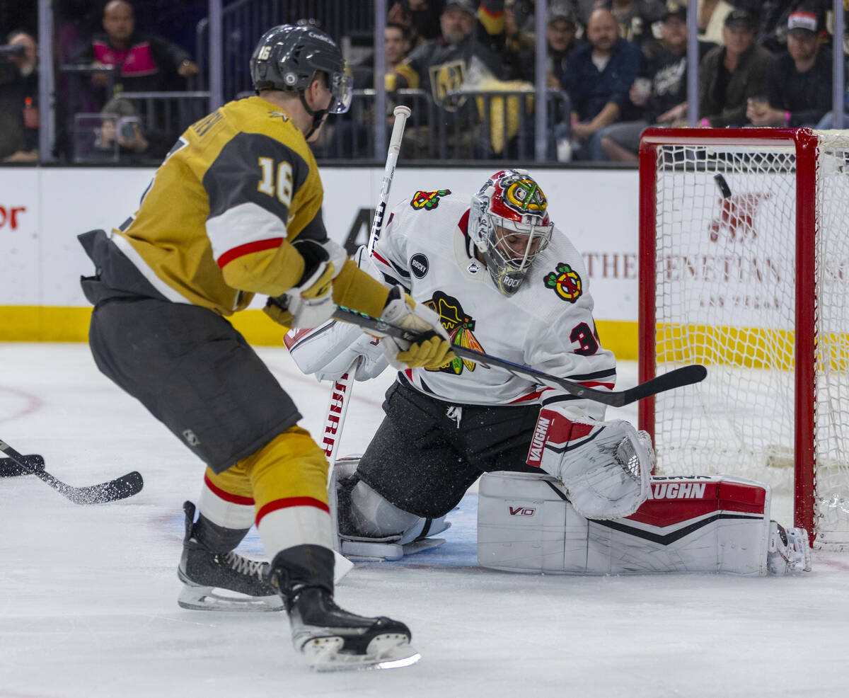 Golden Knights left wing Pavel Dorofeyev (16) sends a puck past Chicago Blackhawks goaltender P ...