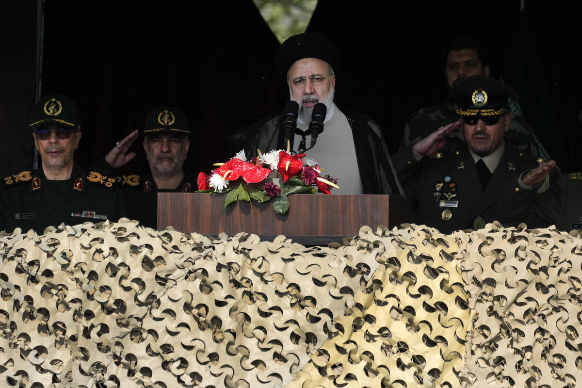 Iranian President Ebrahim Raisi speaks during an Army Day parade at a military base in northern ...