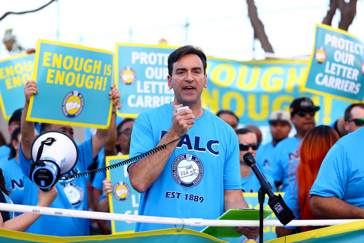 Paul Peterman, president of the local National Letter Carriers Association union, speaks during ...