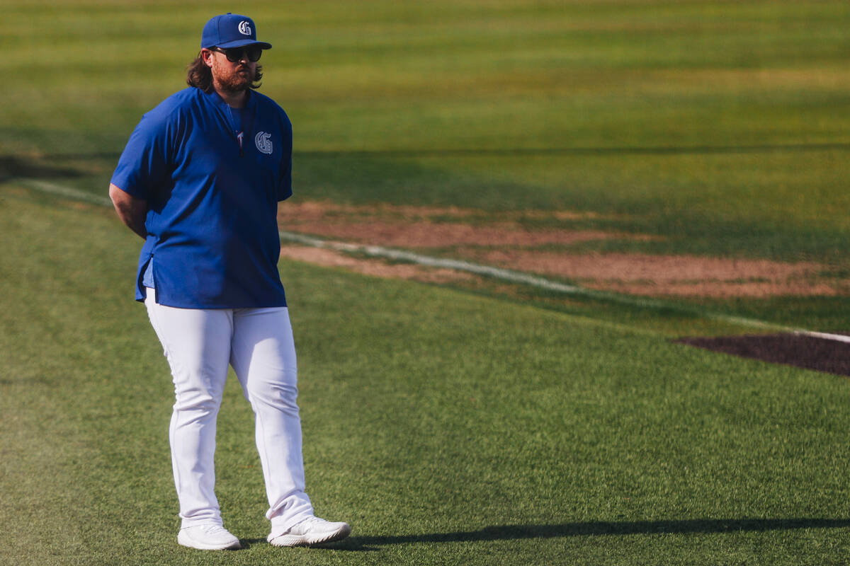 Bishop Gorman interim head coach Jeff Malm watches game action during an baseball game between ...