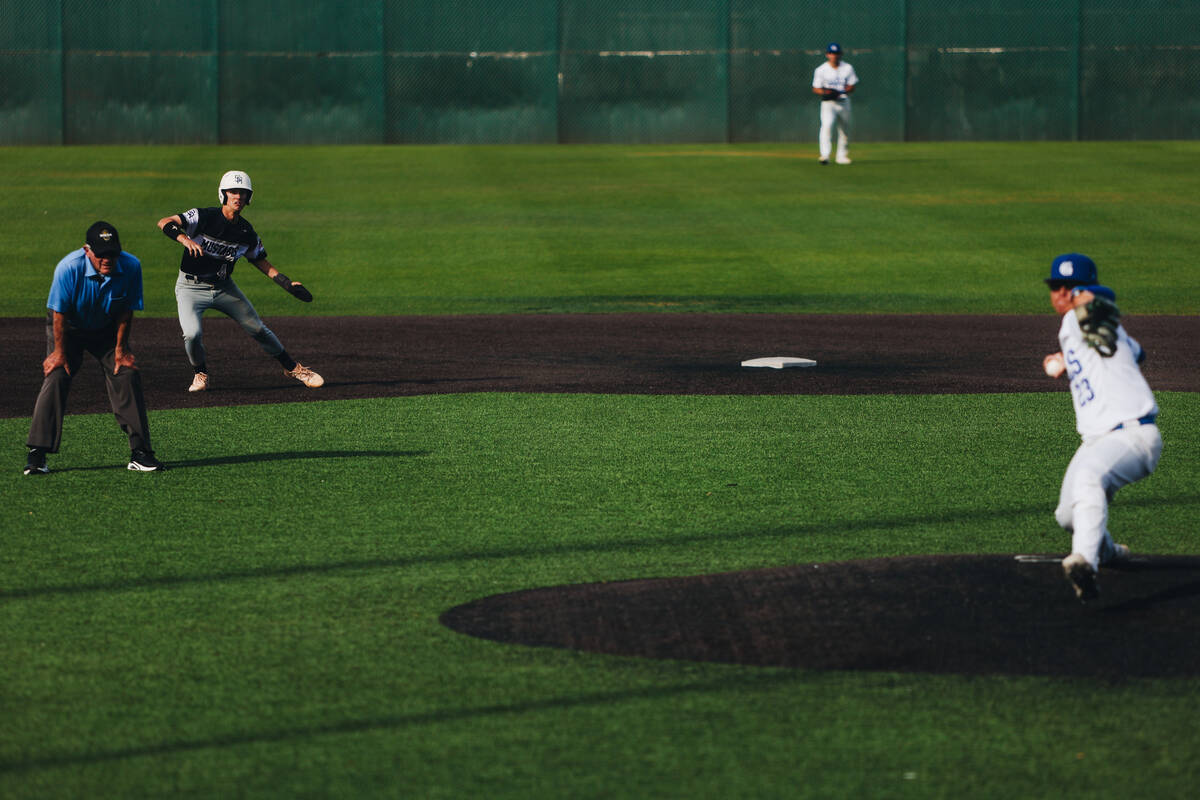 Shadow ridge pitcher Benjamin Moss (4) gets ready to run to third base during an baseball game ...