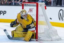 Golden Knights goaltender Logan Thompson (36) eyes a puck coming his way from the Chicago Black ...