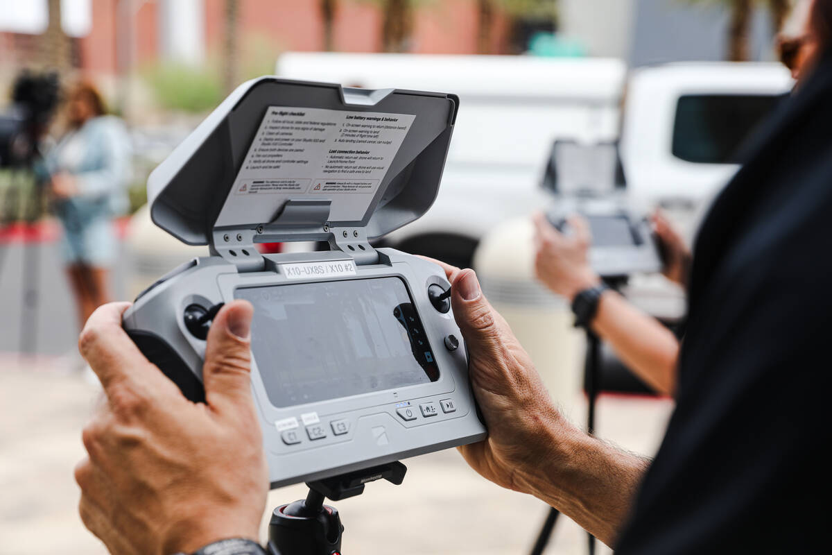 Joshua Mack, a civilian drone operator, operates a drone for a media demonstration outside Metr ...